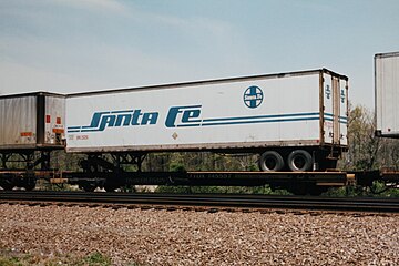 A Santa Fe semi-trailer carried on a flatcar as part of a TOFC train.