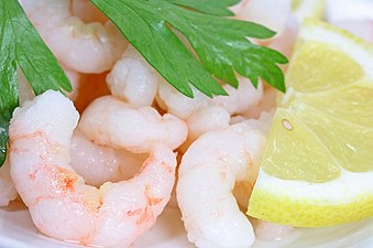 The shells and flesh of steamed shrimp contain a natural carotenoid pigment called astaxanthin, which turns pink when heated. The same process turns cooked lobster and crab from blue-green to red when they are boiled.