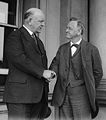 Denby shaking hands with his predecessor as Secretary of the Navy, Josephus Daniels