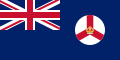 A British Blue Ensign (a blue flag with the Union Jack placed at the top left corner) charged with the badge of Singapore.