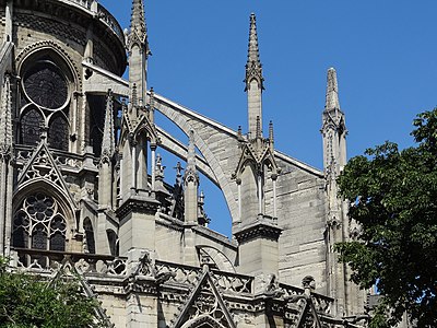 Choir and ambulatory of Notre Dame Cathedral, begun in 1163, were much remodeled after a fire in 1220; the triforia were abolished and gave place to an enlargement of the clerestory, the flying buttresses were exchanged for new ones, and the file of chapels was added to the ambulatory.