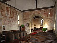 The 12th-century frescos in St Botolph's Church, England, are part of the 'Lewes Group' of Romanesque paintings created for Lewes Priory.[42]