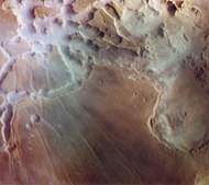 In this Viking 1 image, the canyons of Noctis Labyrinthus are filled with water ice fog from frost sublimated by the early morning sun.