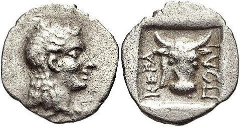 Ancient Greek obol from Ceramus, with the head of the god Apollo and a bucranium, 2 BC, probably silver, unknown location
