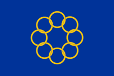 Flag featuring 8 golden interlocked rings on a blue background.