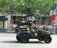 A VBL with a heavy machine gun during the military parade on the avenue des Champs-Élysées