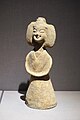 Earthenware Nanjing female figure wearing youren upper garment and a skirt with a straight-necked undergarment; d. Southern dynasty.[90]