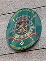 Lesser coat of arms on an embassy plaque