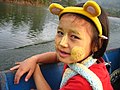 A Karen child with thanaka on her face