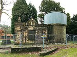 the observatory; a stone building with a round tower, the top of which is clad in metal