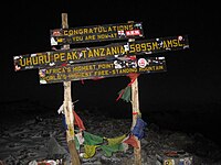 Sign at Uhuru peak, indicating to trekkers that they have reached the top.