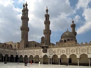 Photo of a hypostyle gallery, a dome, and three minarets