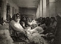 Armenian refugees from Turkey carding wool in Tiflis, Georgia. Photograph by Melville Chater from the National Geographic Magazine, 1920.