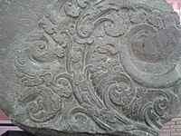 Dvaravati period stone sculpture located in Phra Pathom Chedi National Museum