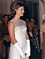 Jacqueline Kennedy wearing evening gloves at a state dinner in 1962.