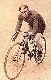 A man sitting on a bicycle.