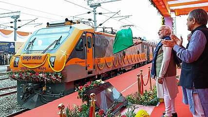 Prime Minister Narendra Modi flagging off the first Amrit Bharat Express train, the Darbhanga–Anand Vihar Terminal Amrit Bharat Express, in the presence of the Minister of Railways, Ashwini Vaishnaw, from the new station building of Ayodhya, on 30 December 2023.