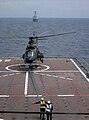 125 Squadron Super Puma takes off from the flight deck of the RSS Resolution – an Endurance-class LST. Visible in the foreground is the Aircraft Ship Integrated Secure and Traverse (ASIST) system.