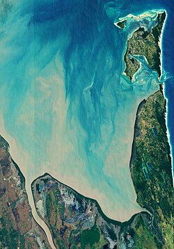The southern perimeter of Maputo Bay from space: Machangulo peninsula and Inhaca Island are at right and top right respectively.
