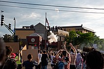 Police fire tear gas on protesters at the third precinct station in Minneapolis on May 27