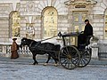 A Hansom cab being filmed as part of a costume drama.