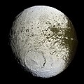 Image 17 Iapetus Photo credit: Cassini orbiter False-color mosaic shows the entire hemisphere of Iapetus (1,468 km or 912 mi across) visible from the Cassini orbiter on the outbound leg of its encounter with the two-toned moon of Saturn in September 2007. The central longitude of the trailing hemisphere is 24 degrees to the left of the image's center. It is hypothesized that the moon's two-toned nature is due to the sublimation of various ices evaporated from the warmer parts of the surface. More selected pictures