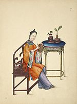 Woman playing a xiaoluo.