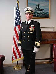 A navy captain's "Full Dress Blue Uniform" with full-sized medals, white gloves and sword (2007)