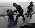 An Ecuadorian maritime interdiction team, armed with MP5s, assigned to conduct a visit, board, search, and seizure exercise.