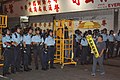 PTU creating a blockade the Mong Kok Occupied Area, while STC officers push the mobile platform.