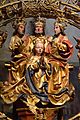 Krönung Mariens mit der später verbotenen Darstellung der Dreifaltigkeit als Figur mit drei Köpfen und zwei Armen (Ausschnitt), Basilika Seckau, Bischofskapelle, Mariä-Krönungsaltar (geweiht 1489)
