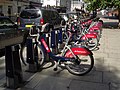 Image 21"Boris Bikes" from the Santander Cycles hire scheme waiting for use at a docking station in Victoria.