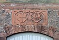 Wappenstein von 1567 über dem Portal