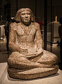 Seated portrait statue of Dersenedj, scribe and administrator; circa 2400 BC; rose granite; height: 68 cm; from Giza; Egyptian Museum of Berlin