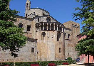 The Cathedral of Santa Maria d'Urgell, Catalonia, has an apsidal east end projecting at a lower level to the choir and decorated with an arcade below the roofline. This form is usual in Italy and Germany.