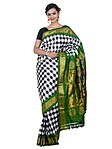 Indian sari in a two-colour tartan pattern with highlights at the crossings of the black lines, which may be embroidery or supplementary weaving