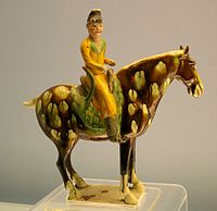 A Tang dynasty sancai glazed figurine an equestrian figure on a horse