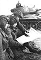 Image 43Soldiers in an East German tank unit reading about the erection of the Berlin Wall in 1961 in Neues Deutschland (from Newspaper)