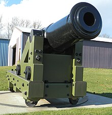 Large smoothbore cannon on a turntable, viewed from the front