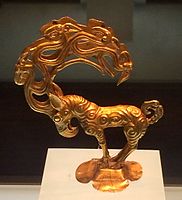 Gold stag with eagle's head, characteristic of the new style introduced by the Ordos nomads. Excavated at the southern border of the Ordos desert.[12]