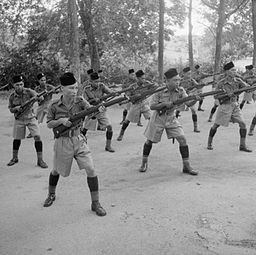 Men of the Rejimen Askar Melayu DiRaja wearing songkok at bayonet practice, Singapore Island (1941).