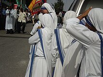 Missionaries of Charity weaing the traditional Sari during a religious procession in the streets of Port-au-Prince, Haiti, on the occasion of the feast of Saint Perpetua.