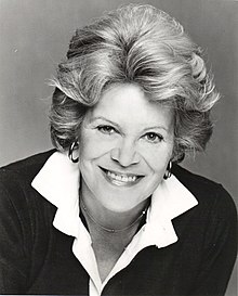 Black and white portrait photograph of Roberts in 1976. She is smiling and looking into the camera.