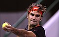 Roger Federer swings to take a shot in Doha.