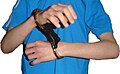 Handcuffs applied in front stack position
