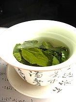 Oolong tea leaves steeping in a gaiwan