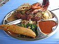 Image 9Traditional Tanzanian food consisting of pilau kuku (seasoned rice with chicken), mishkaki (grilled meat), ndizi (plantain), maharage (beans), mboga (vegetables), chapati (flatbread) and pili pili (hot sauce) (from Culture of Tanzania)