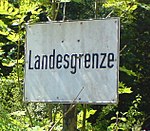 Bayerisches Hinweisschild an der Staatsgrenze zu Tirol