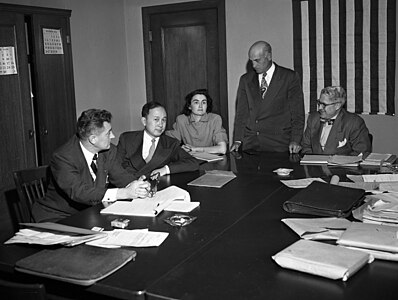Qian at his deportation hearing, 1950. Others, from left, are Grant B. Cooper, Xuesen's attorney; a hearing reporter, Albert Del Guercio, examining officer, and Ray Waddell, hearing officer.