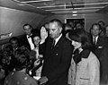 Lyndon B. Johnson taking the oath of office on Air Force One